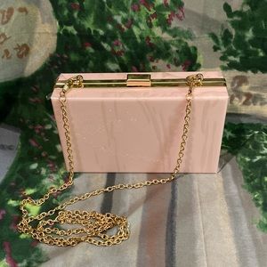 Pink square purse with gold chain strap
